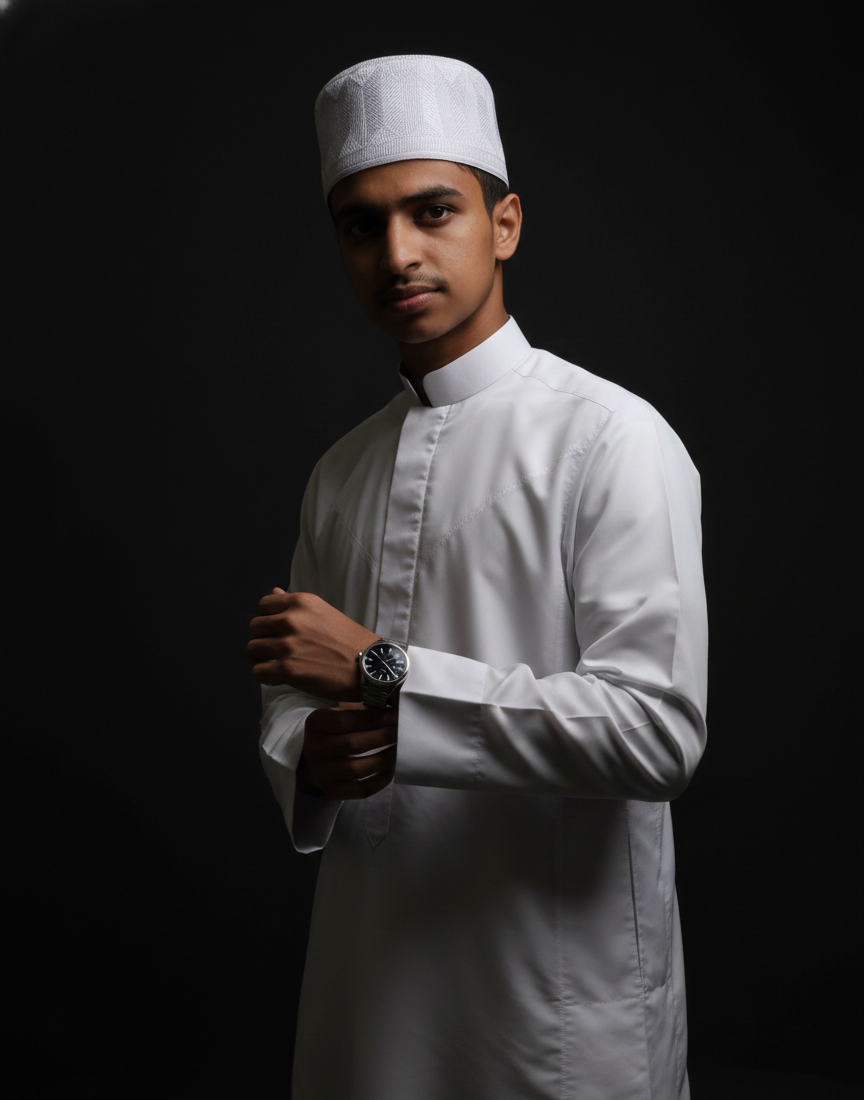 Professional portrait of the best freelance digital marketer in Malappuram wearing traditional Islamic attire while using a mobile phone.